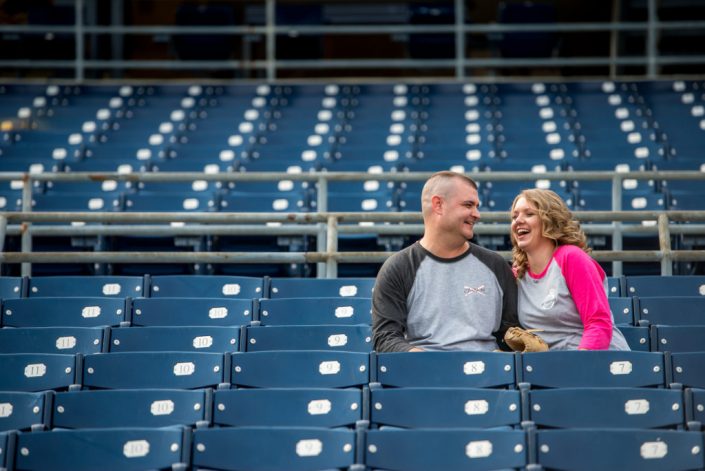 Batter up, these baseball fans hang out in the stands for engagement photos in Norfolk, VA