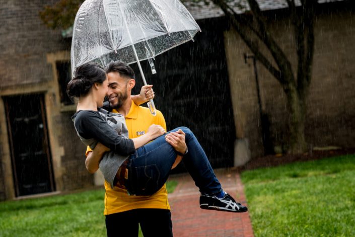 Engagement photo with an umbrella in the rain at VCU in Richmond, VA