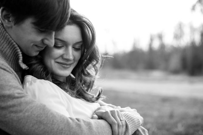 Sweet couple snuggle in for a hug during their engagement session in Mechanicsville Virginia