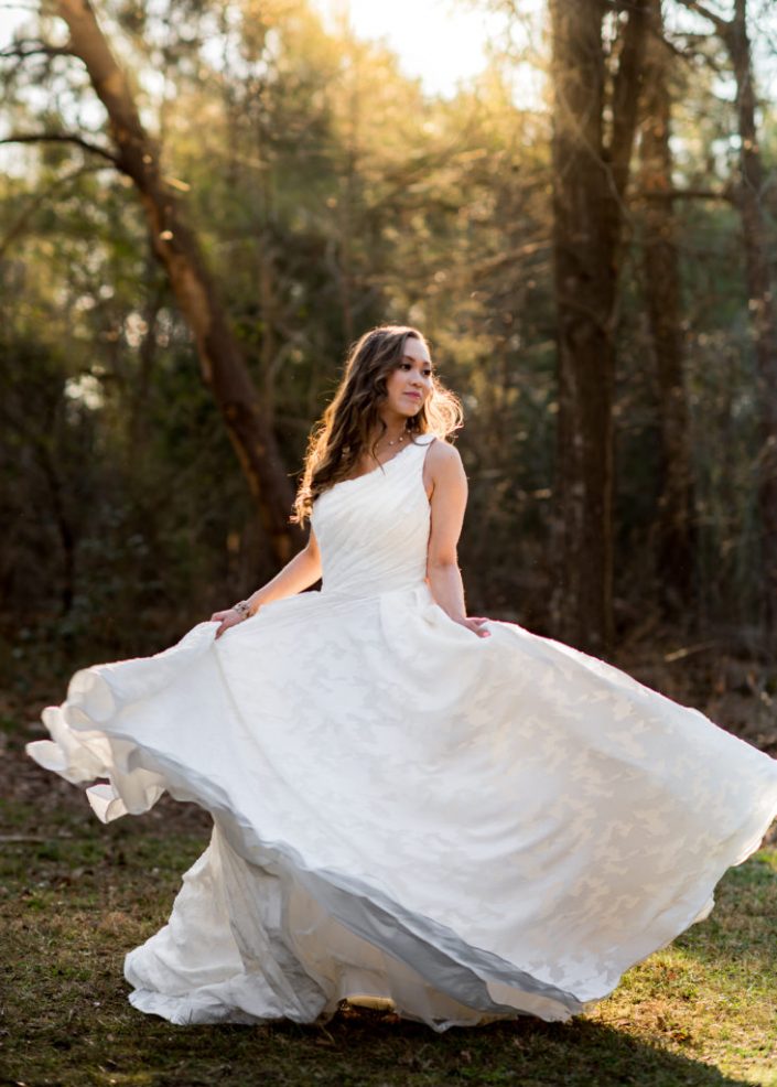 Gorgeous bridal portrait with sunlight and flowy gown