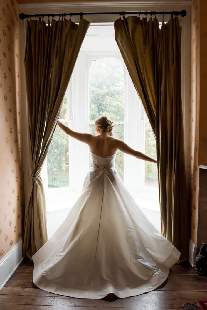 Bride portait silhouette in front of window in bridal suite at Linden Row Inn, Richmond, VA