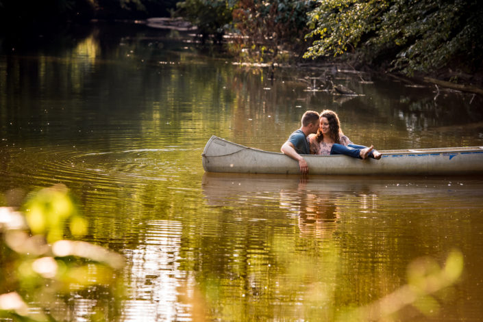 Romantic engagement photo in canoe on the water in the summer Louisa, VA
