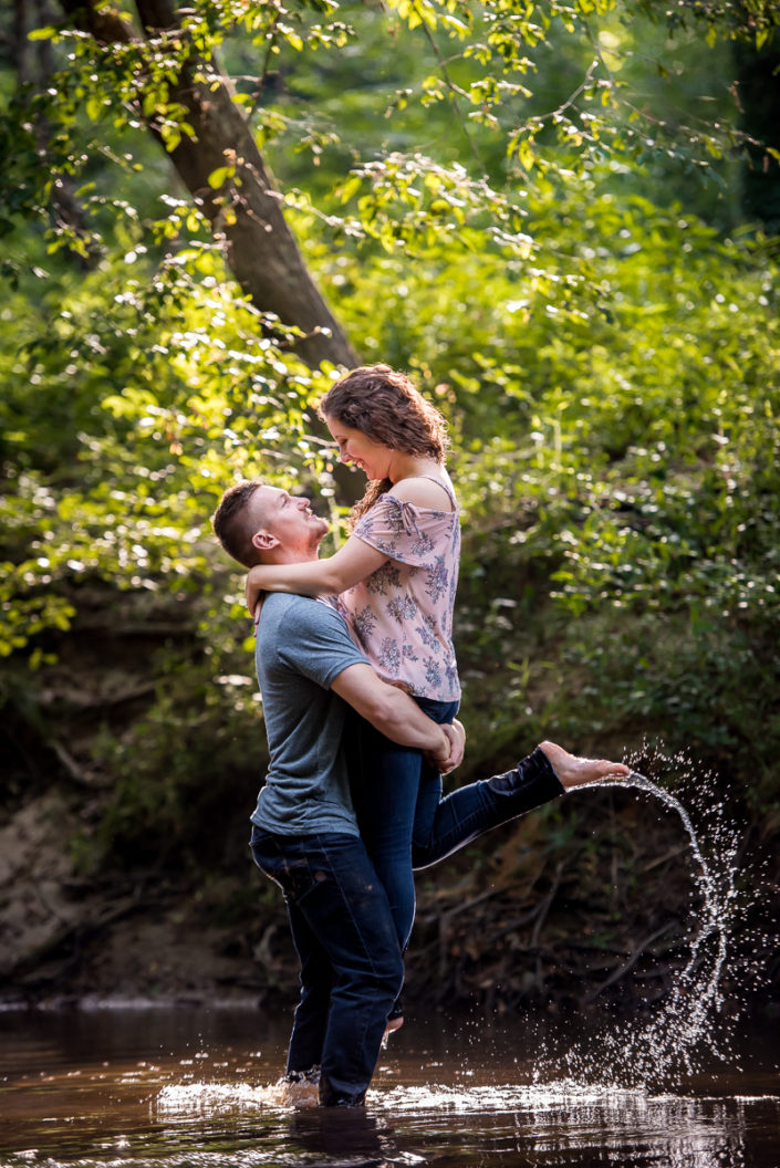 Couple plays in water for best engagement photographer in Richmond VA
