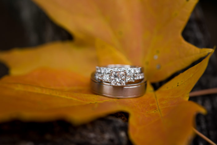top wedding photographer Richmond VA ring shot on fall leaf