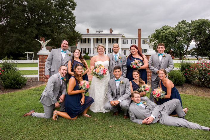Hollyfield Manor wedding party pose for a group photo on lawn King William, VA