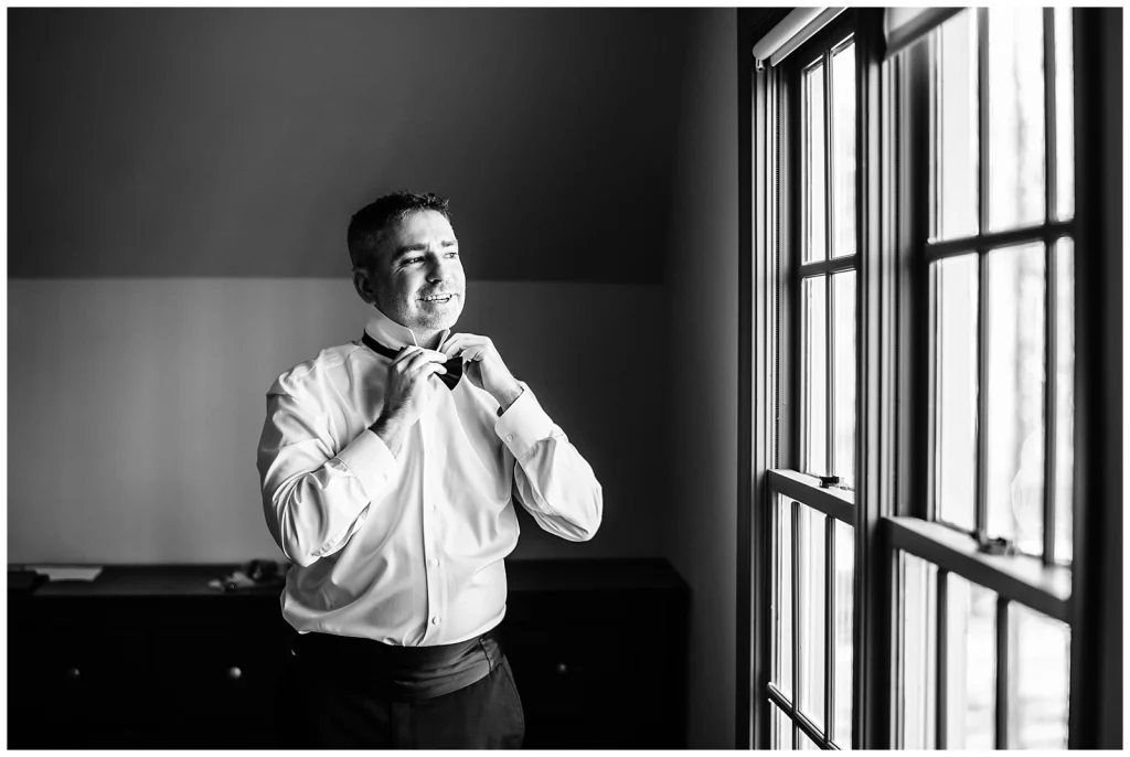 Groom getting dressed in his home in Glen Allen VA