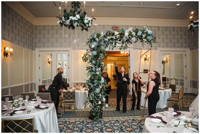 Marylee Marmer team moves the altar setup to the sweetheart table