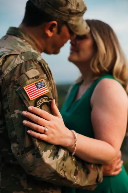 Military engagement photo with engagement ring on the ranger patch